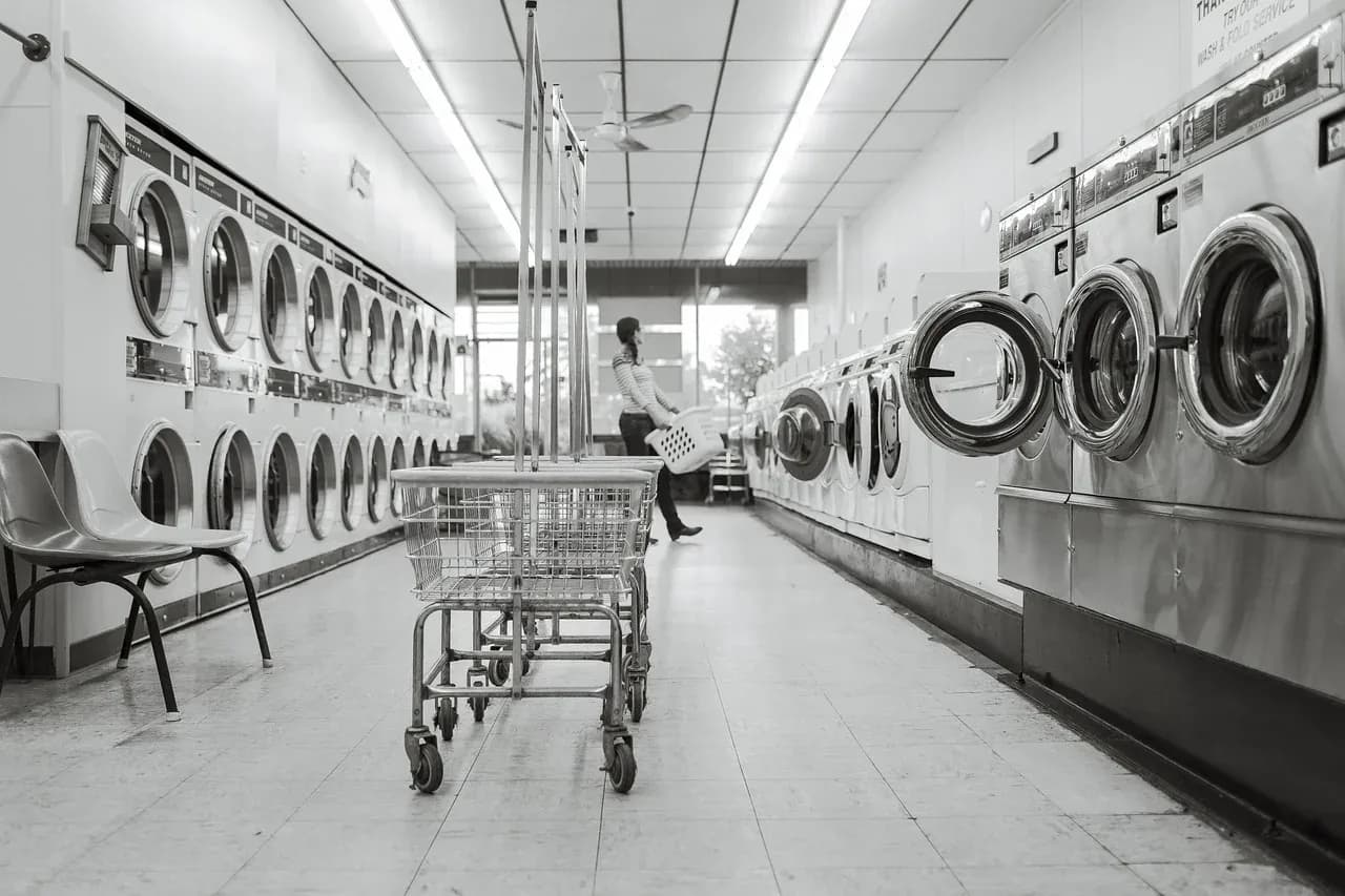 Rows of washing machines in a laundrette