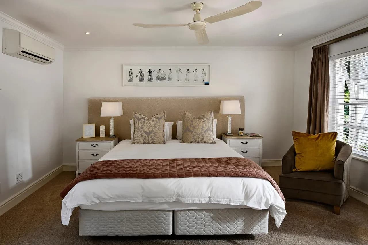 White duvet and pillows in a bright bedroom