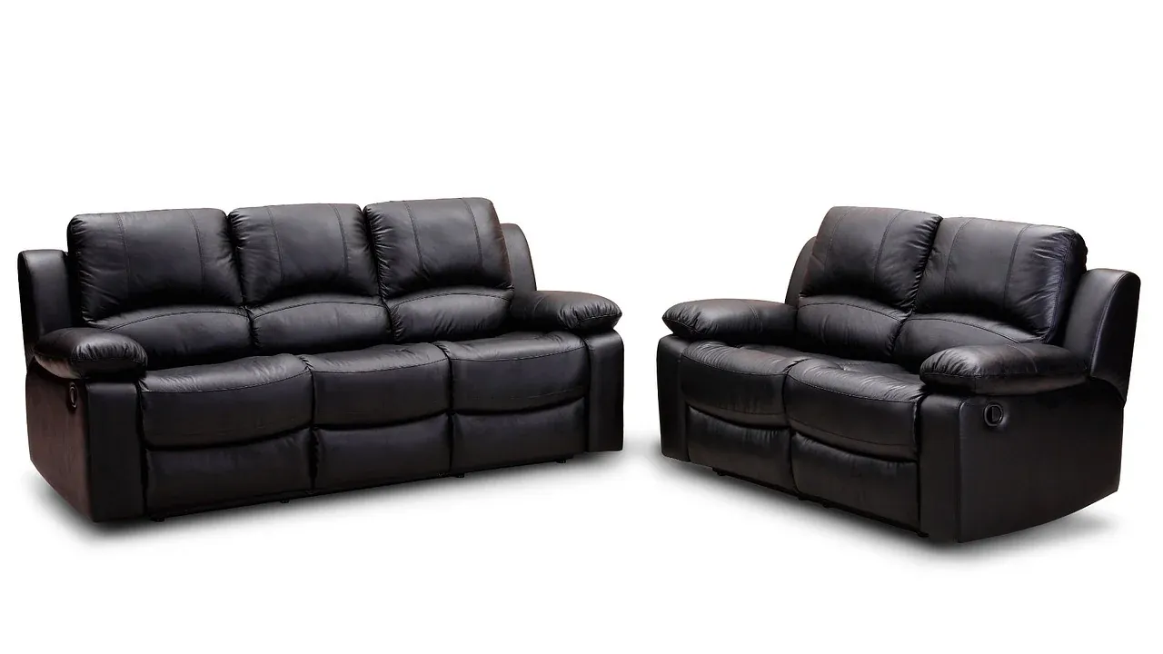 Black leather sofa and two matching armchairs