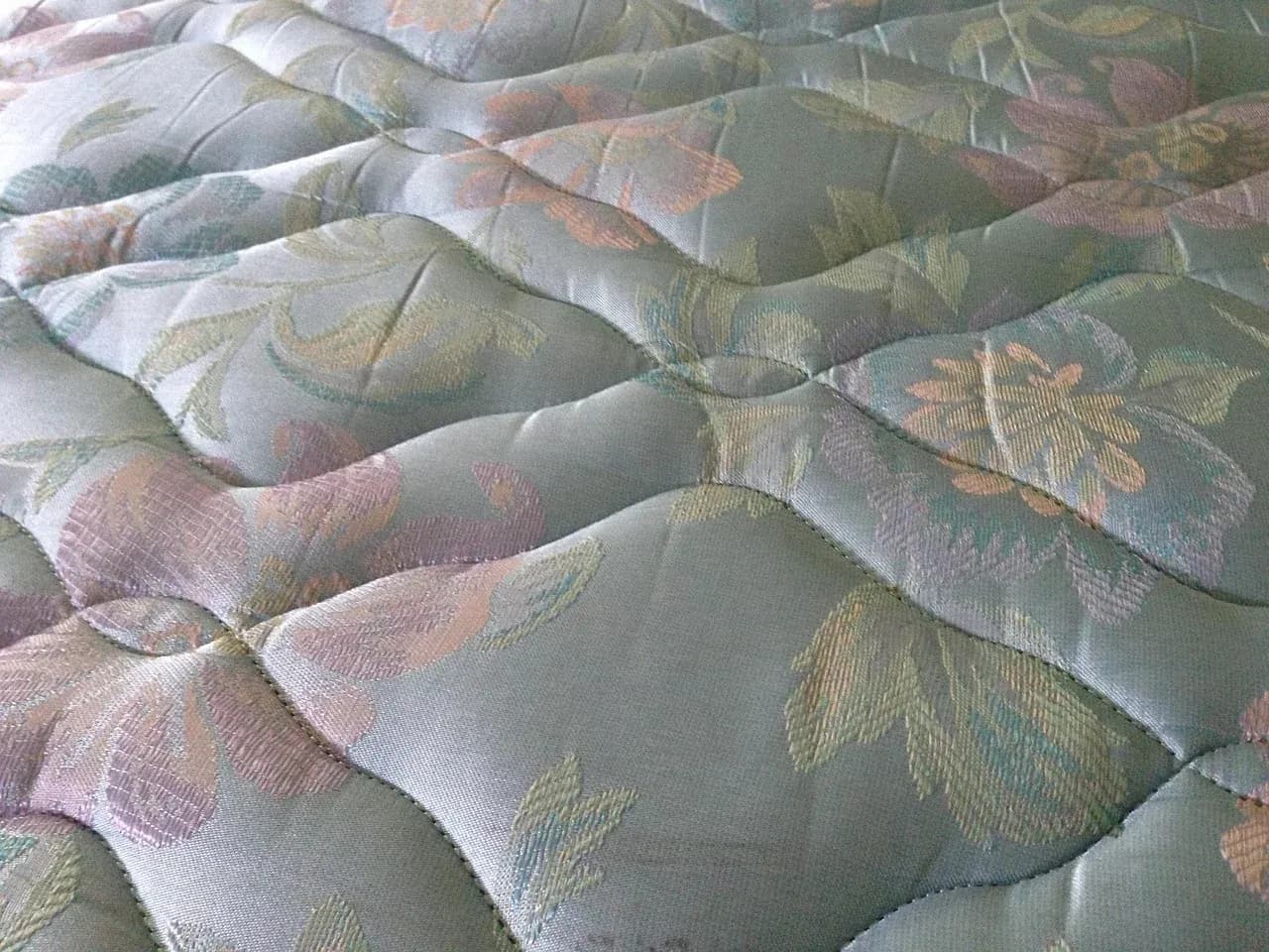 Close-up of a quilted mattress surface