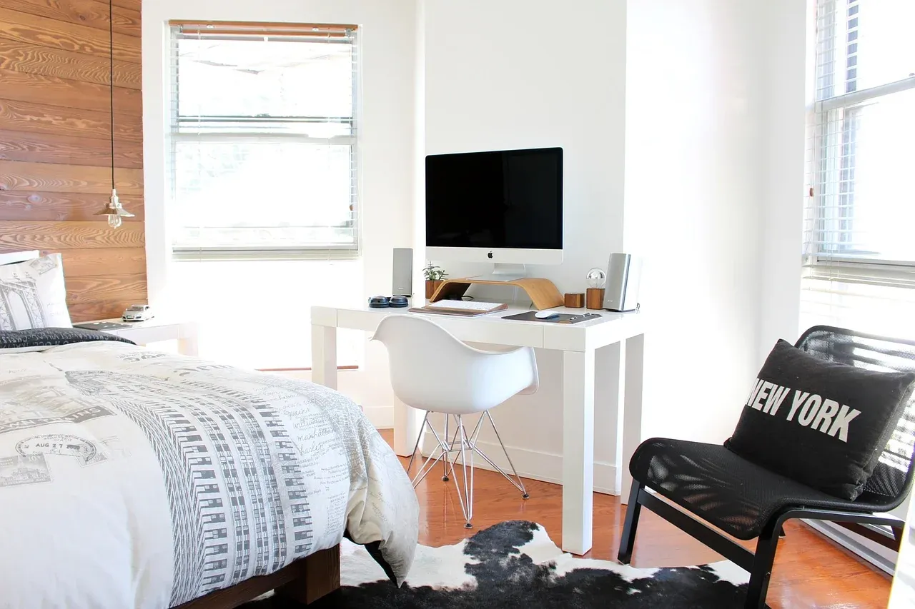 Bed and desk in a bright bedroom