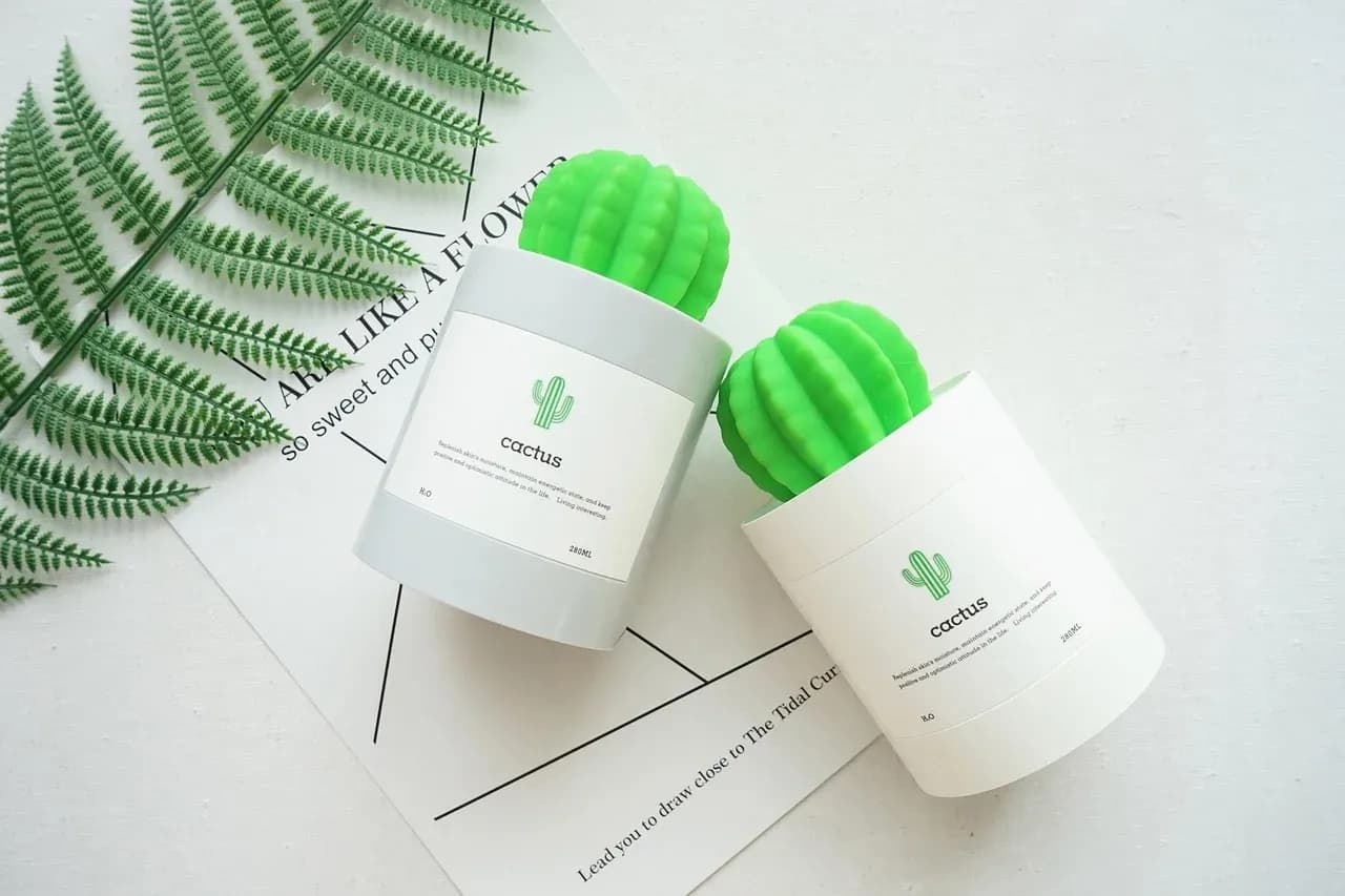 Two small cactus-shaped misting devices