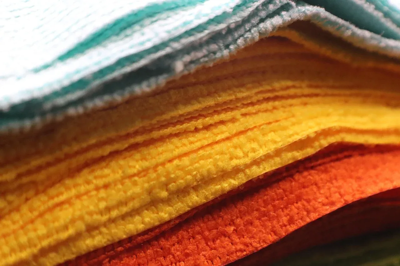 Stack of folded towels in warm colours