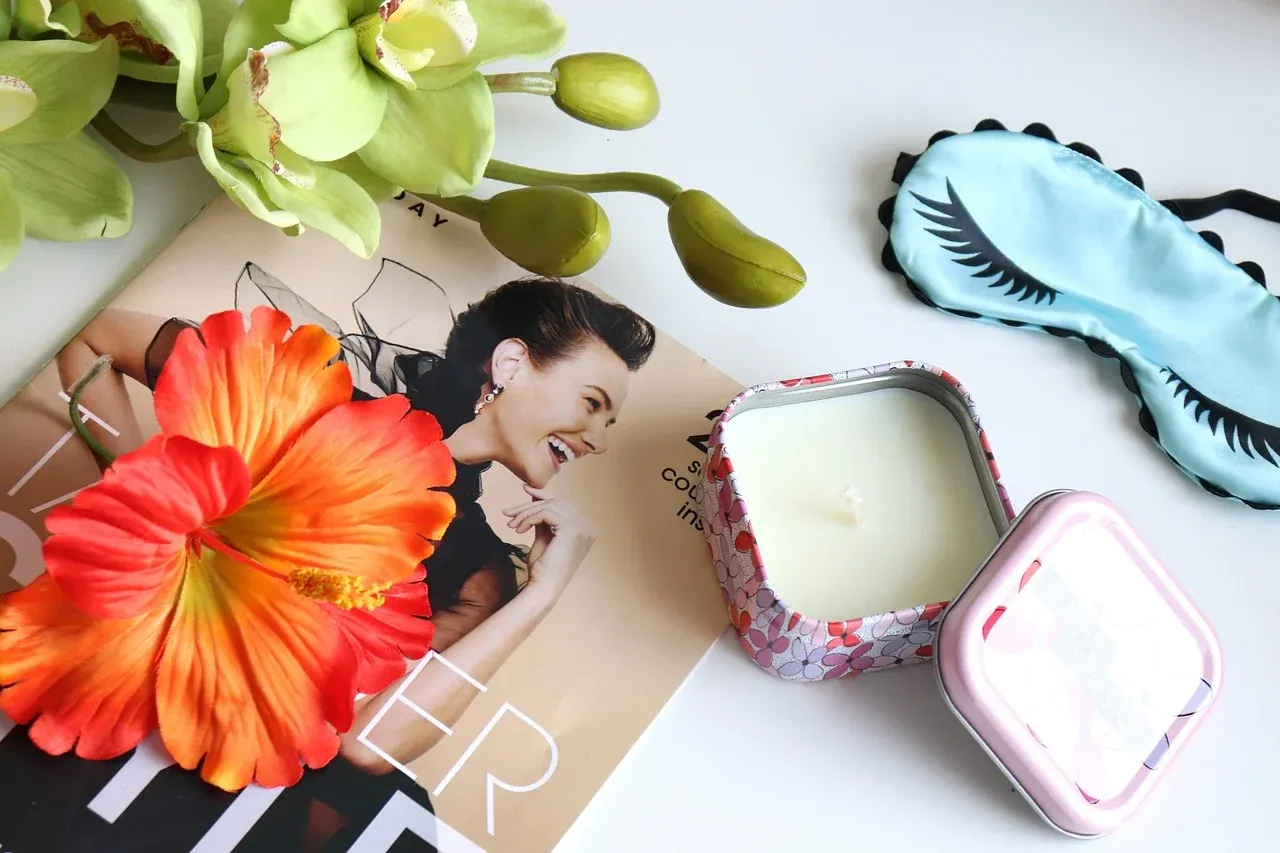 Sleep mask and self-care items arranged on a table