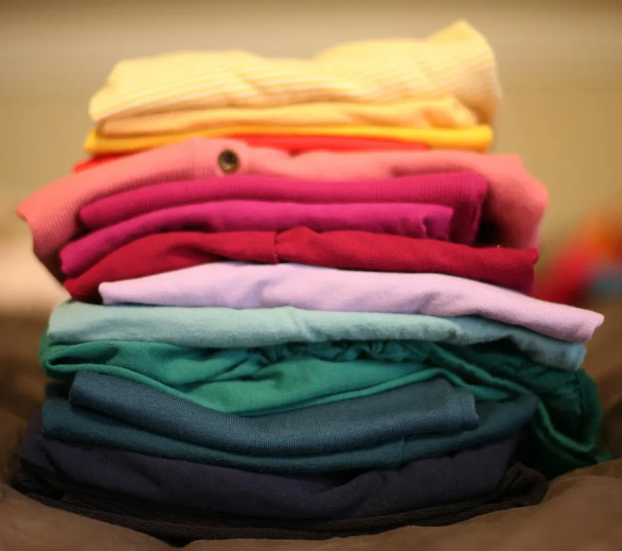 Stack of folded colourful clothing