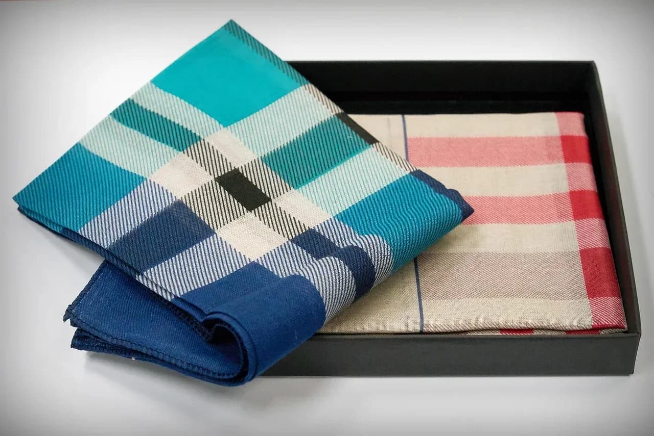 Folded checked fabrics arranged in a box